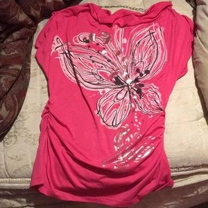 A pink butterfly and floral blouse.